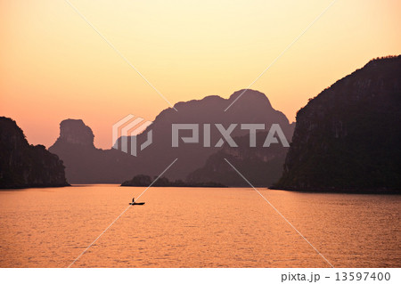 Sunset in Halong Bay, Vietnam. Unesco World Heritage Site. 13597400