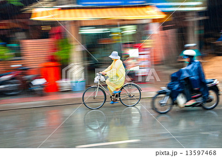 Motion blur astract of a bike and a motorbike rider in Ho Chi Mi Motion blur astract of a bike and a motorbike rider in Ho Chi Mi 13597468