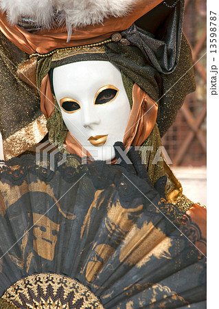 VENICE - MARCH 05: Participant in The Carnival of Venice, an ann 13598787