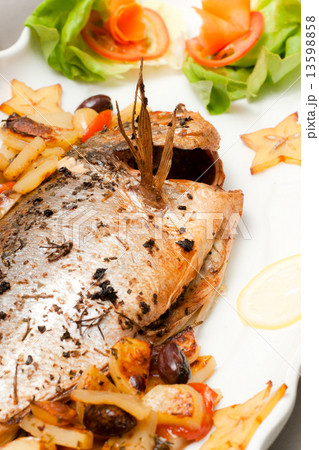 Italian dessert panna cotta on white plate decorated with strawb 13598858