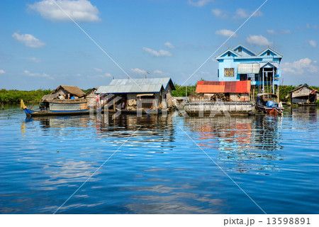Floating House and Houseboat on the Tonle Sap lake, Cambodia. Floating House and Houseboat on the Tonle Sap lake, Cambodia. 13598891