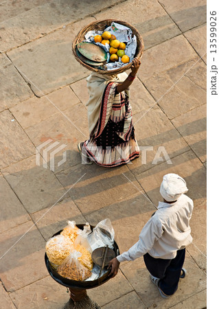 Two peoples working on the ghat, Varanasi (Benares) 13599026