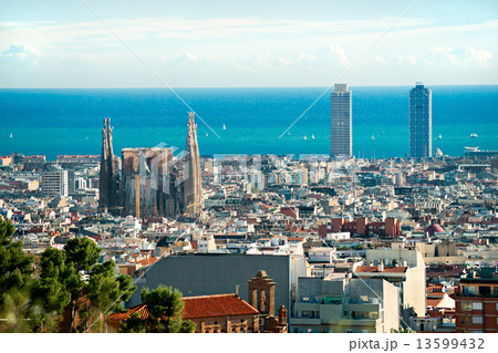 View of Sagrada Familia and port from Park Guell. Barcelona, Spa 13599432