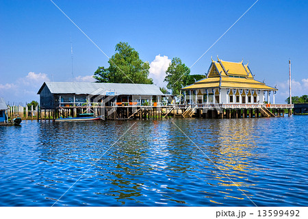 Floating House and temple on the Tonle sap lake, between Siem Re Floating House and temple on the Tonle sap lake, between Siem Re 13599492