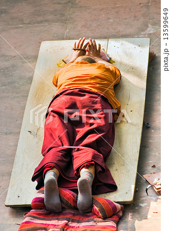 Monk praying. Monk praying. 13599649