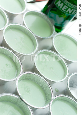Mint panna cotta on white plate decorated with strawberry and or 13601256