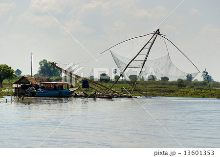 Fishing net and houseboat. Tonle Sap Lake, Cambodia. Fishing net and houseboat. Tonle Sap Lake, Cambodia. 13601353