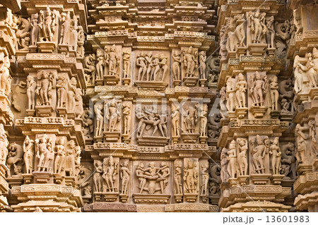 Kamasutra scene on the wall of a Temple in Khajuraho. 13601983