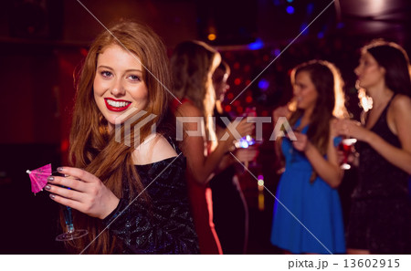 Pretty redhead drinking a cocktail Pretty redhead drinking a cocktail 13602915