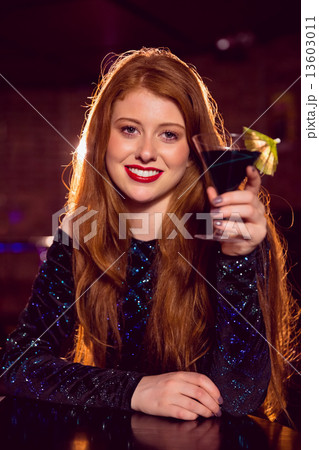 Pretty redhead drinking a cocktail Pretty redhead drinking a cocktail 13603011