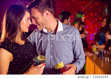 Cute couple drinking cocktails together 13603244