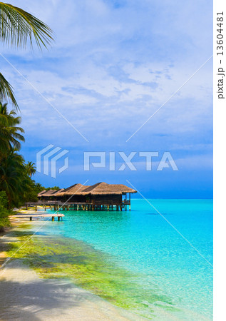 Water bungalows on a tropical island Water bungalows on a tropical island 13604481