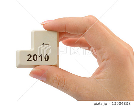 Computer button 2010 in hand Computer button 2010 in hand 13604838