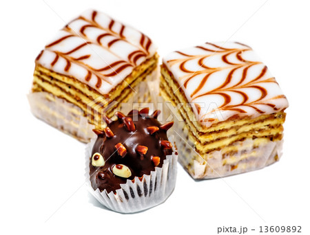 Layered cakes and chocolate hedgehog isolated Layered cakes and chocolate hedgehog isolated 13609892