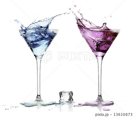 Martini Glasses with Splashing Fruity Cocktails. 13610873