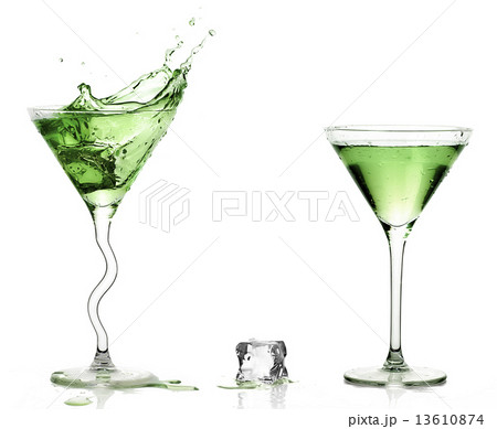 Martini Glasses with Splashing Green Cocktails. 13610874