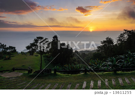 Colorful sunrise above the clouds 13611255