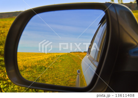 Looking Out Car Window with Reflection in Side Mirror 13611408