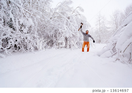 Bearded man with an ax in his raised hand screaming 13614697