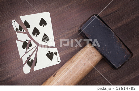 Hammer with a broken card, seven of spades Hammer with a broken card, seven of spades 13614785