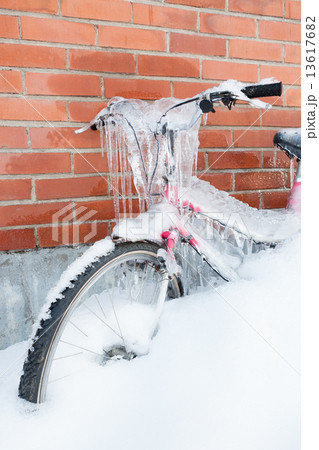 Frozen bike covered in ice 13617682
