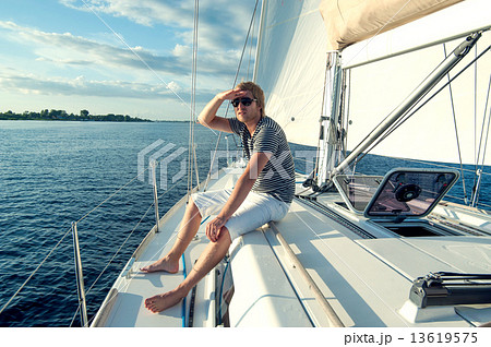 Happy young man on a yacht Happy young man on a yacht 13619575