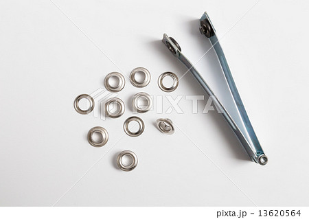 Rivets on a light background. 13620564