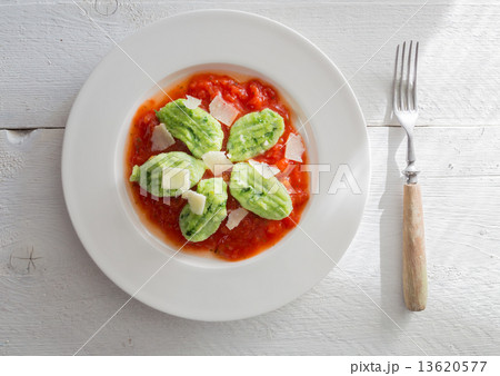 Gnocchi with wild garlic in tomato sauce and parmesan cheese 13620577