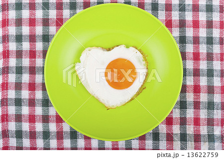 Scrambled in a heart shape on a plate. Scrambled in a heart shape on a plate. 13622759