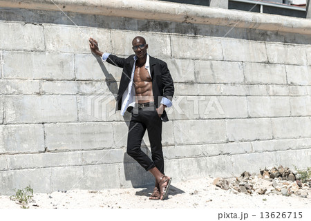 African black man model with six pack in black suit and unbuttoned white shirt and sunglasses 13626715