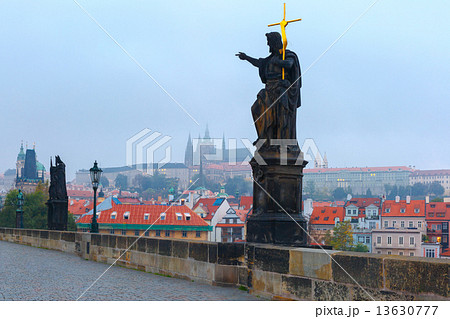 Charles Bridge in Prague (Czech Republic) at cloudy morning. 13630777