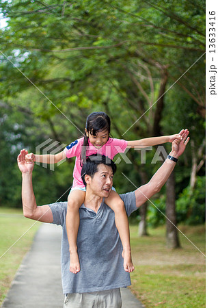 Asian Father and Daughter in the Park Asian Father and Daughter in the Park 13633416