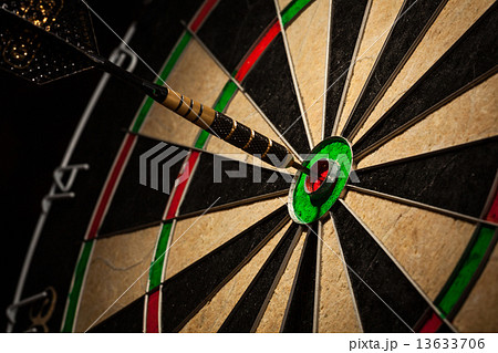Dart in bull's eye close up Dart in bull's eye close up 13633706