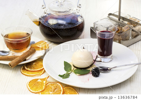 creamy dessert is decorated with blackberries on a white background creamy dessert is decorated with blackberries on a white background 13636784