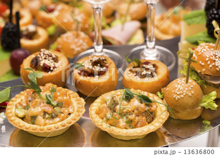 Canapes of cheese vegetables meat and seafood on white background Canapes of cheese vegetables meat and seafood on white background 13636800