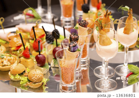 Canapes of cheese vegetables meat and seafood on white background 13636801