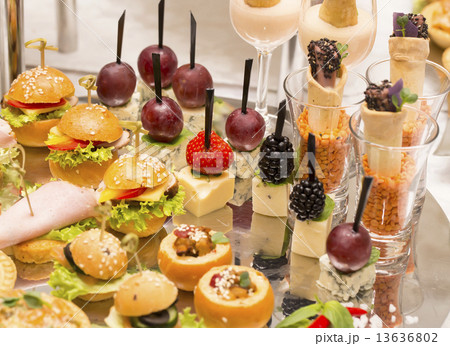 Canapes of cheese vegetables meat and seafood on white background 13636802