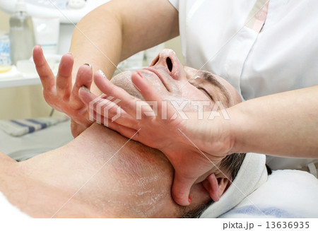 man in a beauty salon facial and massage man in a beauty salon facial and massage 13636935