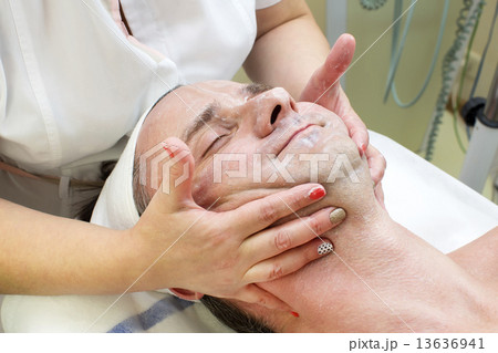 man in a beauty salon facial and massage man in a beauty salon facial and massage 13636941