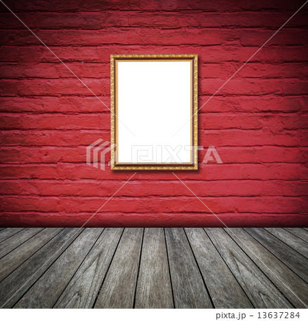 frame of photo on red wall inside the room. 13637284