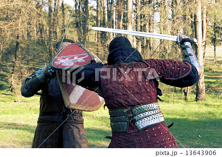 Two knights fighting in the fores Two knights fighting in the fores 13643906