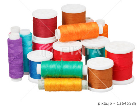 various thread bobbins isolated on white various thread bobbins isolated on white 13645538