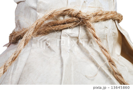 packing rope knotted on the bottle close up 13645860