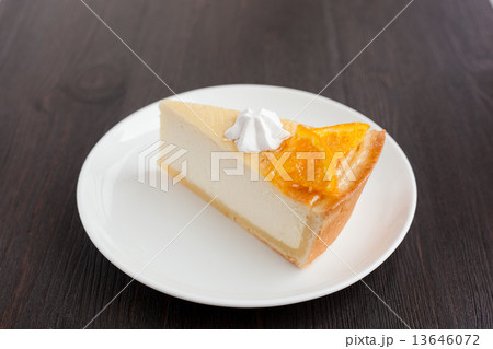 Cheesecake Dessert decorated with oranges and meringue 13646072