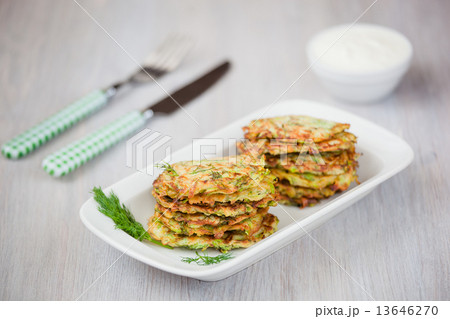 Green pancakes with zucchini and herbs 13646270