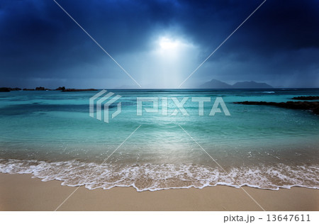 dark sky on the beach of la Digue island, Seychelles 13647611