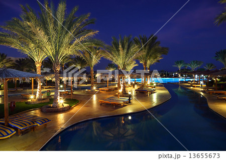 LuxuryTropical Resort Pool in dusk 13655673