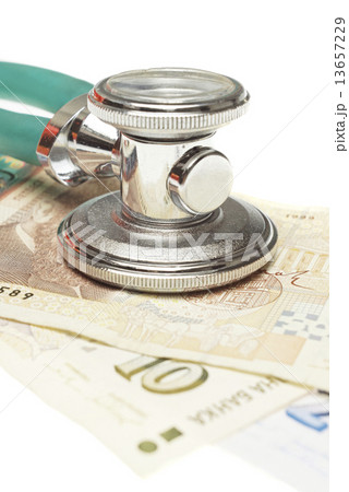 Stethoscope on the top of the money 13657229