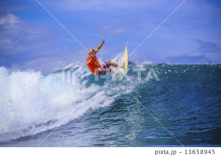 Surfer on Amazing Blue Wave Surfer on Amazing Blue Wave 13658945