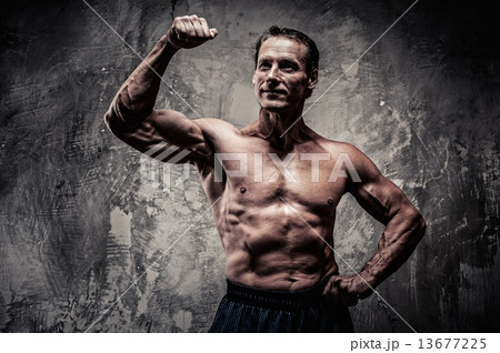 Middle-aged man with muscular body 13677225